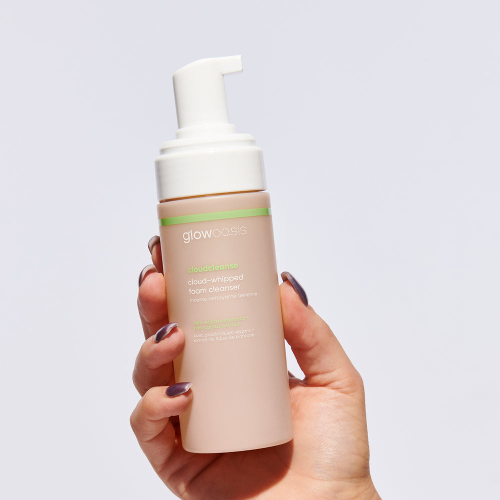 Hand holding glowoasis vegan probiotics cloudcleanse cloud whipped gentle daily foam cleanser