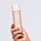 Hand holding glowoasis vegan probiotics milkdew pH balancing moisture milk toner.