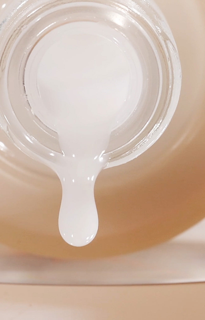 a banner showing an up close view of glowoasis glowshot serum on its side with texture dripping out of the open container