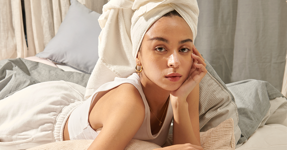 a woman showcasing healthy glowing skin