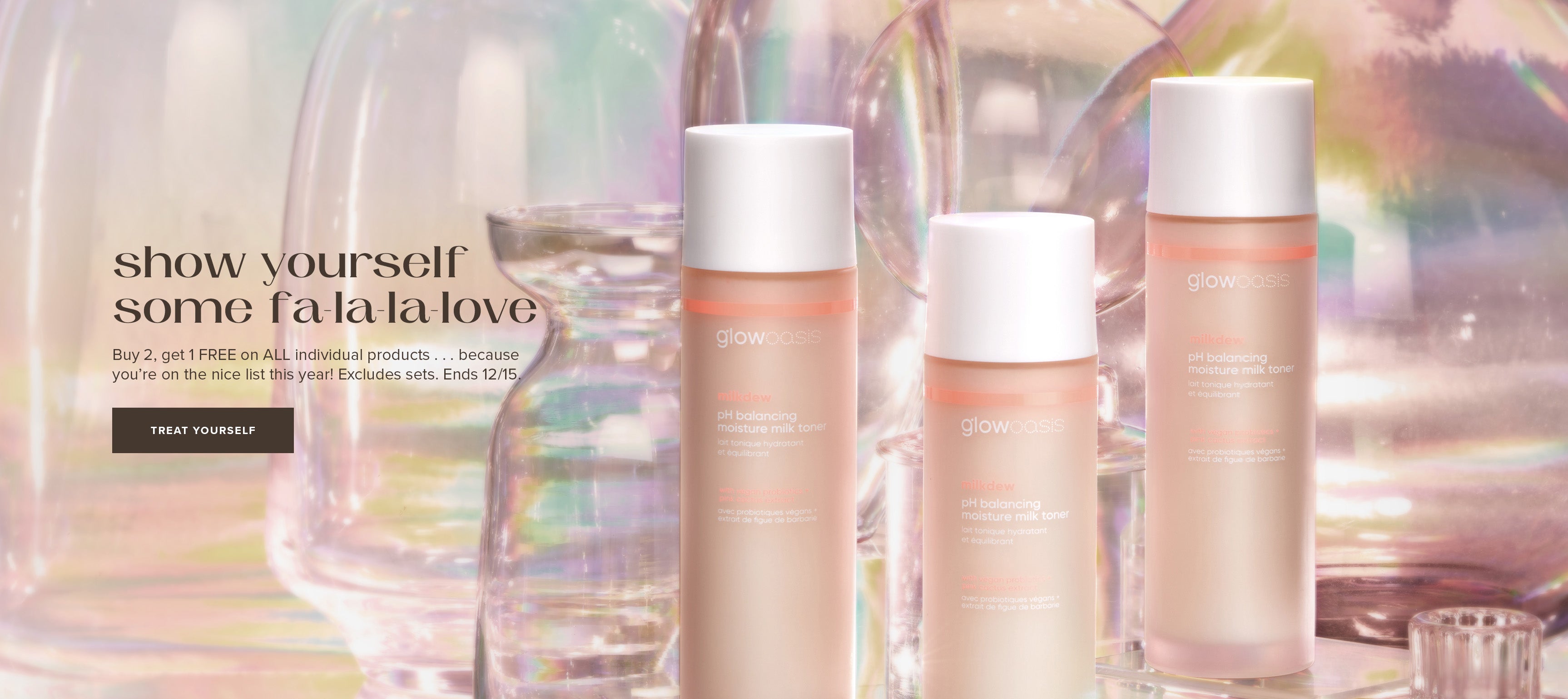 Three glowoasis vegan probiotics milkdew pH balancing toners arranged alongside assorted glasses.
